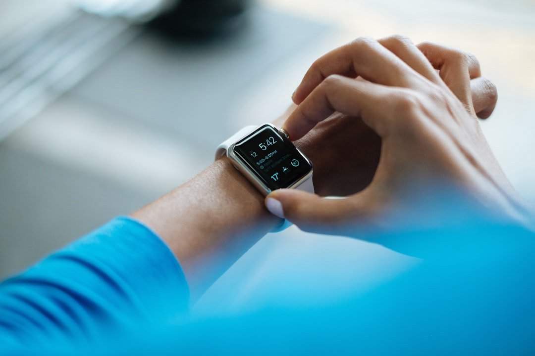 Young Indian man wearing Apple Watch